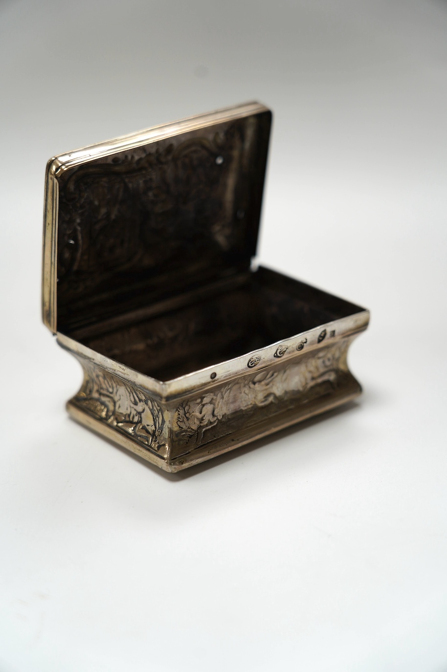 A late 19th century Dutch embossed white metal rectangular snuff box, 83mm, 107 grams. Condition - poor